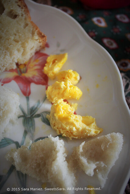 cooked scrambled eggs on a plate with bread