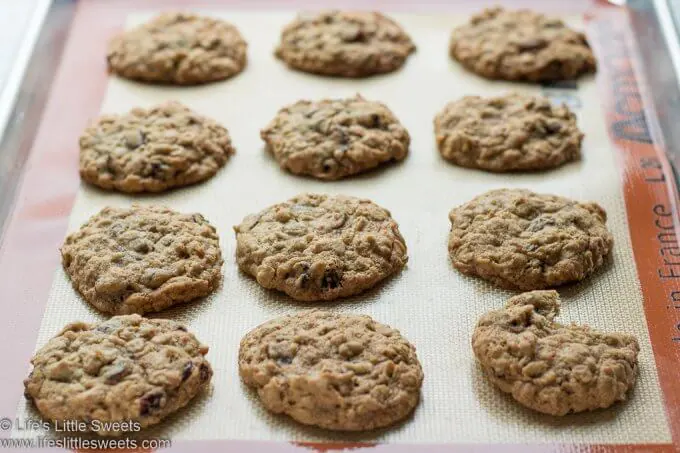 Oatmeal Raisin Cranberry Cookies cooling on a baking sheet 