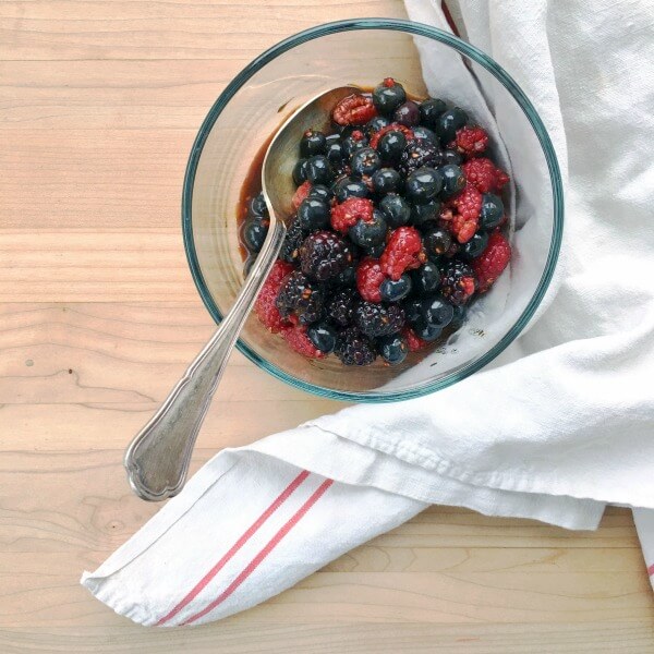 Macerated Triple Berry Topping in a clear bowl