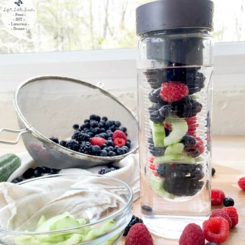 Triple Berry Cucumber Spa Water - Try this recipe for Triple Berry Cucumber Spa Water and you will have a fresh way to stay hydrated on the go. The bonus of having this refreshing, infused water is that you have a delicious berry and cucumber medley to snack on after you finish your water :) Check out my review of this Flavor Infuser Water Bottle from Uncommon Goods!