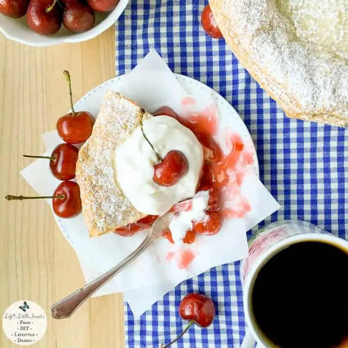 This Easy Cherry Pie with Puff Pastry Crust comes together in 50 minutes with ready-made ingredients and has a touch of unique with a light and crisp puff pastry crust. Enjoy a delicious slice topped with ice cream, whipped cream and fresh cherries! Check out all the #FoodieMamas Cherry Recipes in the roundup!