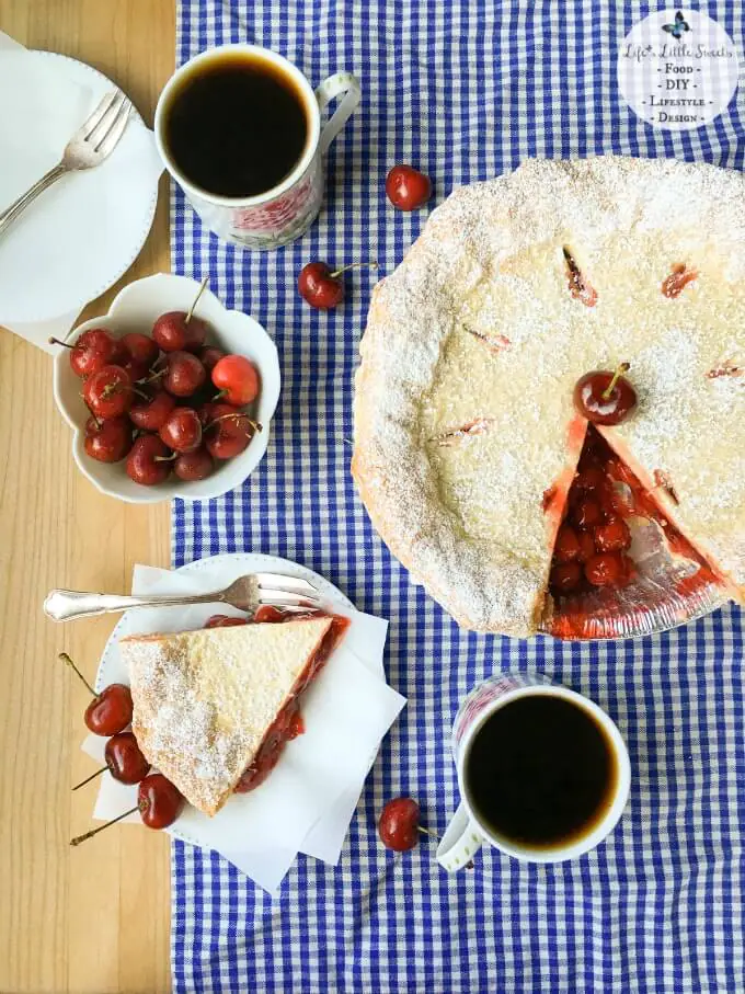 This Easy Cherry Pie with Puff Pastry Crust comes together in 50 minutes with ready-made ingredients and has a touch of unique with a light and crisp puff pastry crust. Enjoy a delicious slice topped with ice cream, whipped cream and fresh cherries! Check out all the #FoodieMamas Cherry Recipes in the roundup!