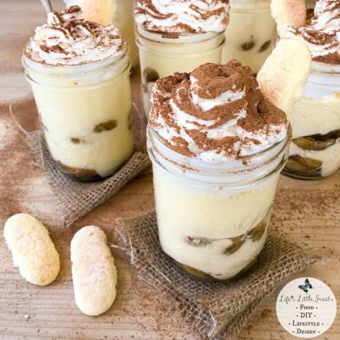 This Mason Jar Tiramisu Trifle is a new take the classic tiramisu dessert. There is plenty to go around as this recipe makes 6 pint-sized mason jars filled with delicious tiramisu dessert, yet only requires 10 ingredients. With 2 layers of delicious, espresso-soaked ladyfingers, rich tiramisu cream and lofty whipped cream dusted with cocoa, Mason Jar Tiramisu Trifle is going to be your new most-requested family favorite!