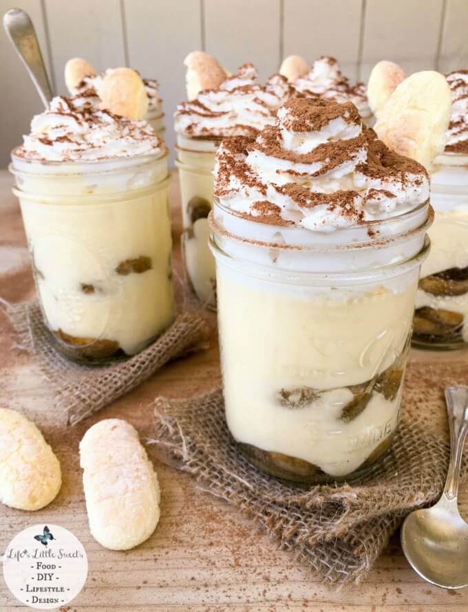 This Mason Jar Tiramisu Trifle is a new take the classic tiramisu dessert. There is plenty to go around as this recipe makes 6 pint-sized mason jars filled with delicious tiramisu dessert, yet only requires 10 ingredients. With 2 layers of delicious, espresso-soaked ladyfingers, rich tiramisu cream and lofty whipped cream dusted with cocoa, Mason Jar Tiramisu Trifle is going to be your new most-requested family favorite! #tiramisu #trifle #cocoa #ladyfingers #chocolate #coffee #dessert