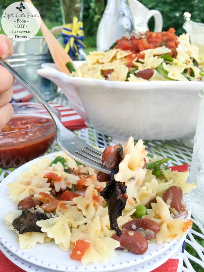 This Savory Mini Farfalle Pasta Quinoa Salsa Salad can be served warm or chilled and is great for bringing to a Summer BBQ, Potluck or any gathering. You can find all your ingredients like Swanson Chicken Broth, truRoots Organic Quinoa and Pace Medium Organic Salsa easily at Sam's Club. It uses only 1 pot for easy cleanup and a chicken broth reduction method to ensure that you get delicious, savory flavor in every bite! #BlockPartyHero #CollectiveBias #ad
