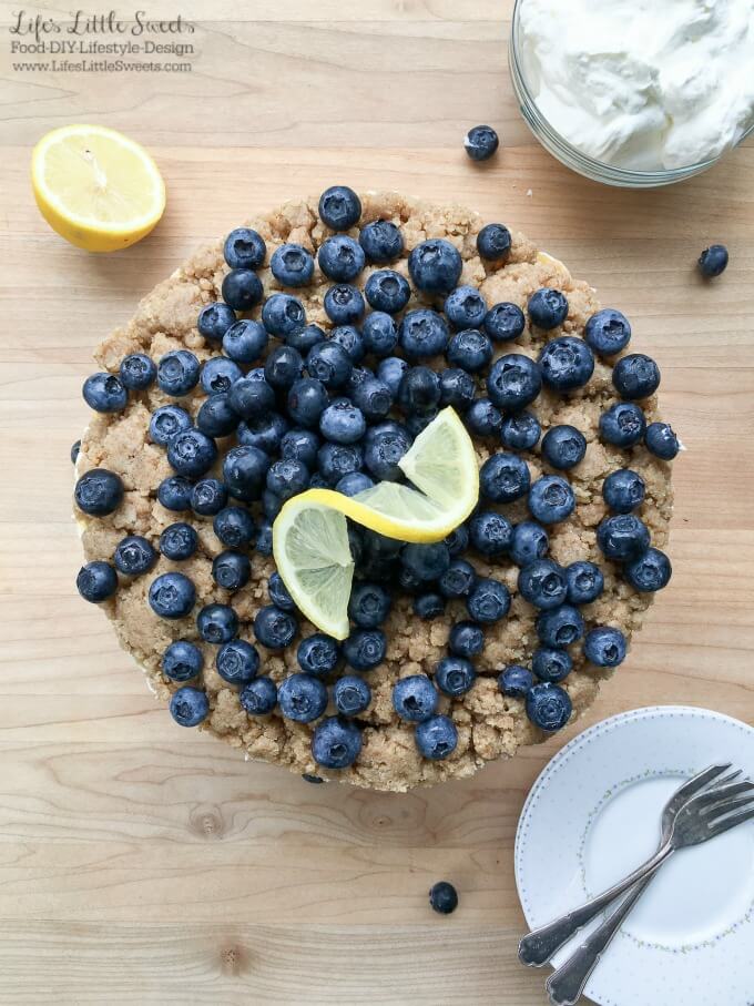 This No Bake Blueberry Lemon Crumble Cheesecake is delicious, zesty and filled with fresh blueberries! Top it off with some Vanilla Whipped Cream for a perfect no bake, Summer dessert!