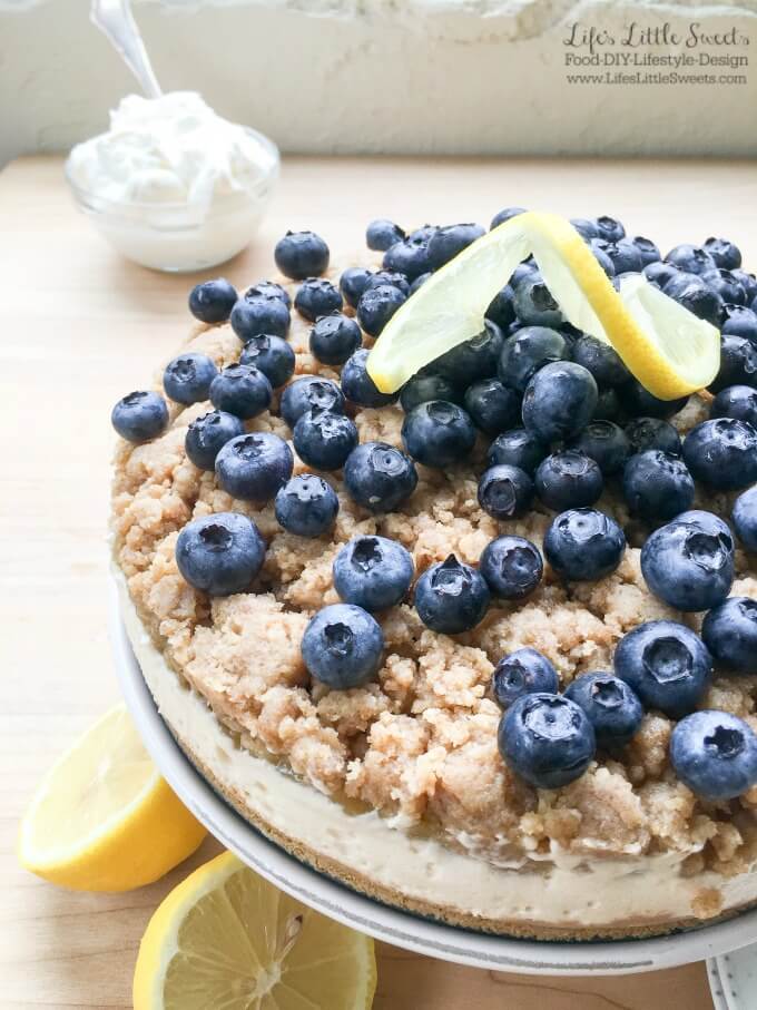 This No Bake Blueberry Lemon Crumble Cheesecake is delicious, zesty and filled with fresh blueberries! Top it off with some Vanilla Whipped Cream for a perfect no bake, Summer dessert!