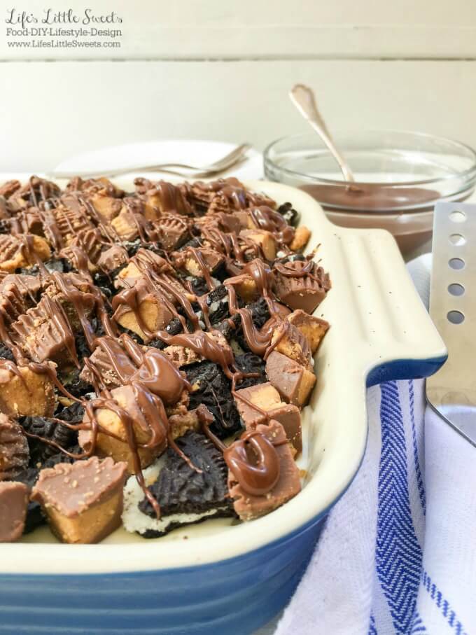 ? This One-Pan Peanut Butter Cup Oreo No Bake Cheesecake combines cheesecake with Oreo cookies and Reese's Peanut Butter Cups to create a decadent dessert! Bring this rich and creamy, no bake, layered dessert to your next gathering for everyone to enjoy.