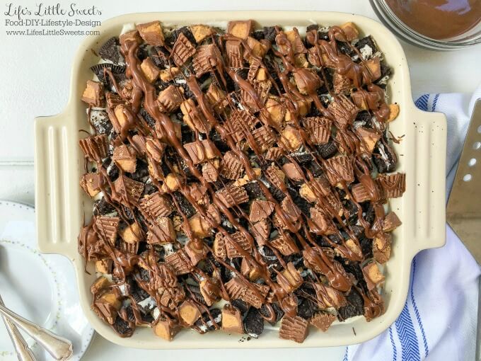 ? This One-Pan Peanut Butter Cup Oreo No Bake Cheesecake combines cheesecake with Oreo cookies and Reese's Peanut Butter Cups to create a decadent dessert! Bring this rich and creamy, no bake, layered dessert to your next gathering for everyone to enjoy.