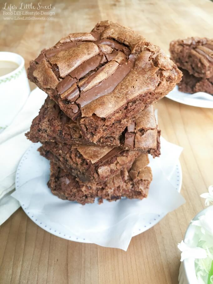 These Chocolate Nutella Brownies are one of my all-time, favorite brownie recipes with 3 kinds of chocolate in them. They are the perfect partner to a hot mug of coffee or tea or a tall glass of milk. Cure your chocolate craving with these incredible, fudgy brownies!