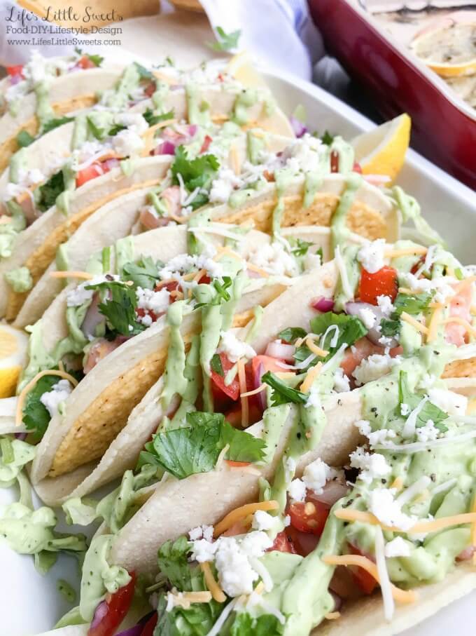 Salmon Tacos with Fresh Salsa and Avocado Sauce - These Salmon Tacos have homemade fresh salsa and a cilantro avocado sauce which will thrill your taste buds. This delicious and satisfying recipe is perfect for game day or a family dinner! #taco #avocadosauce #salsa #citrus #lemon #salmon #tortillas #cheese #lettuce #cabbage