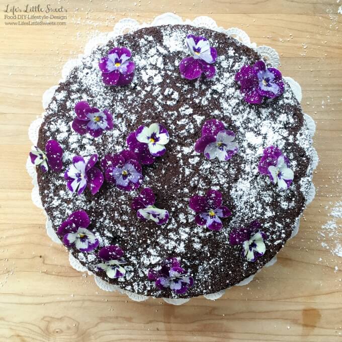 ? This Single-Layer Chocolate Cake with Edible Flowers is a pretty and simple chocolate cake that can be whipped up when you have the need or craving for chocolate cake. No need for frosting for this elegant cake as it is decorated with confectioner's sugar and edible flowers.