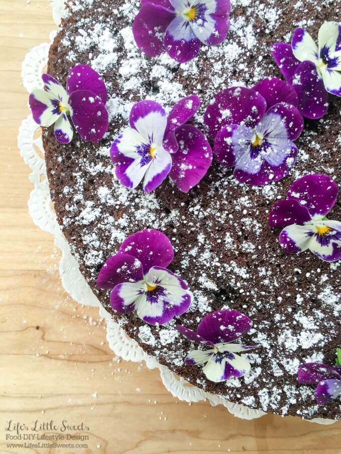 ? This Single Layer Chocolate Cake with Edible Flowers is a pretty and simple chocolate cake that can be whipped up when you have the need or craving for chocolate cake. No need for frosting for this elegant cake as it is decorated with confectioner's sugar and edible flowers.