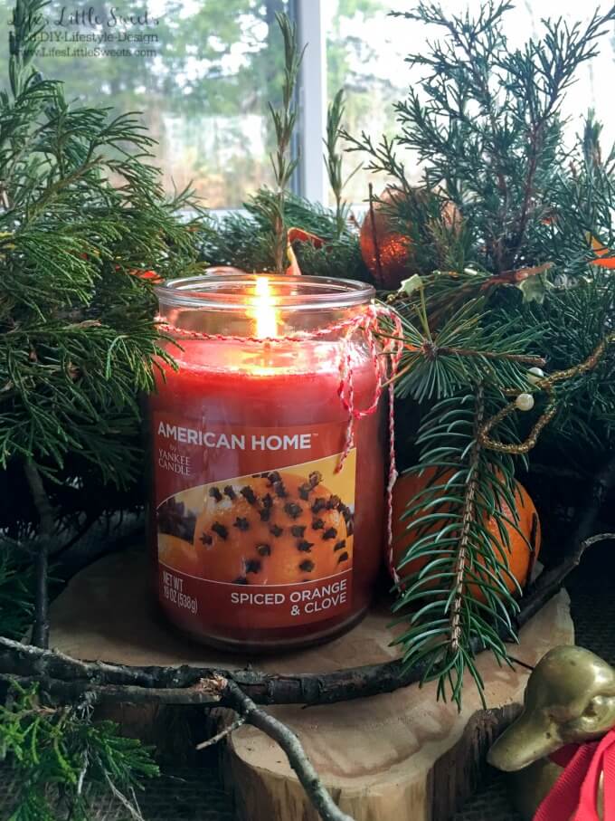 DIY Holiday Table Centerpiece - This DIY Holiday Table Centerpiece is a resourceful and easy craft to prepare. Do make this festive DIY, just use evergreen tree trimmings from your yard, ribbon, ornaments and aromatic American Home™ by Yankee Candle® candles! #LoveAmericanHome #cbias #ad #CollectiveBias