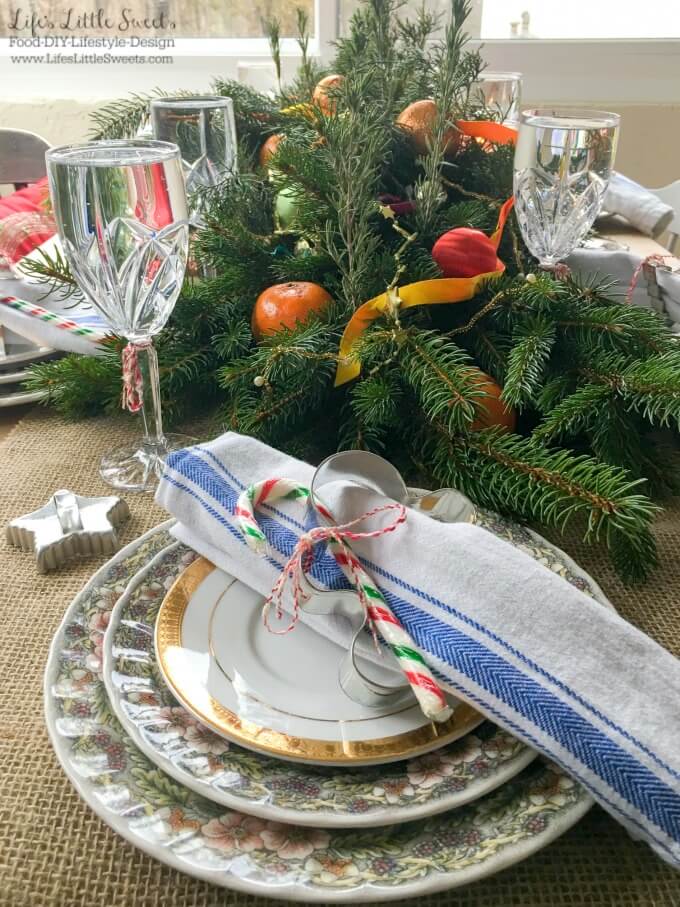 DIY Holiday Table Centerpiece - This DIY Holiday Table Centerpiece is a resourceful and easy craft to prepare. Do make this festive DIY, just use evergreen tree trimmings from your yard, ribbon, ornaments and aromatic American Home™ by Yankee Candle® candles! #LoveAmericanHome #cbias #ad #CollectiveBias