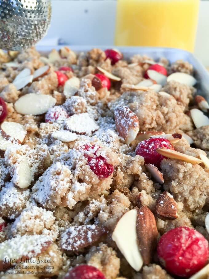 This Orange Cranberry Crumb Cake recipe is perfect for your Holiday or New Year's brunch! It is a dense, orange-flavored cake with a thick, top layer of crumb with tart, fresh cranberries and toasty, slivered almonds baked in. The orange-flavored cake gets it's delicious orange flavor from Minute Maid Orange Juice. #MinuteMaidHoliday #doingood #ad #CollectiveBias @MinuteMaid_US