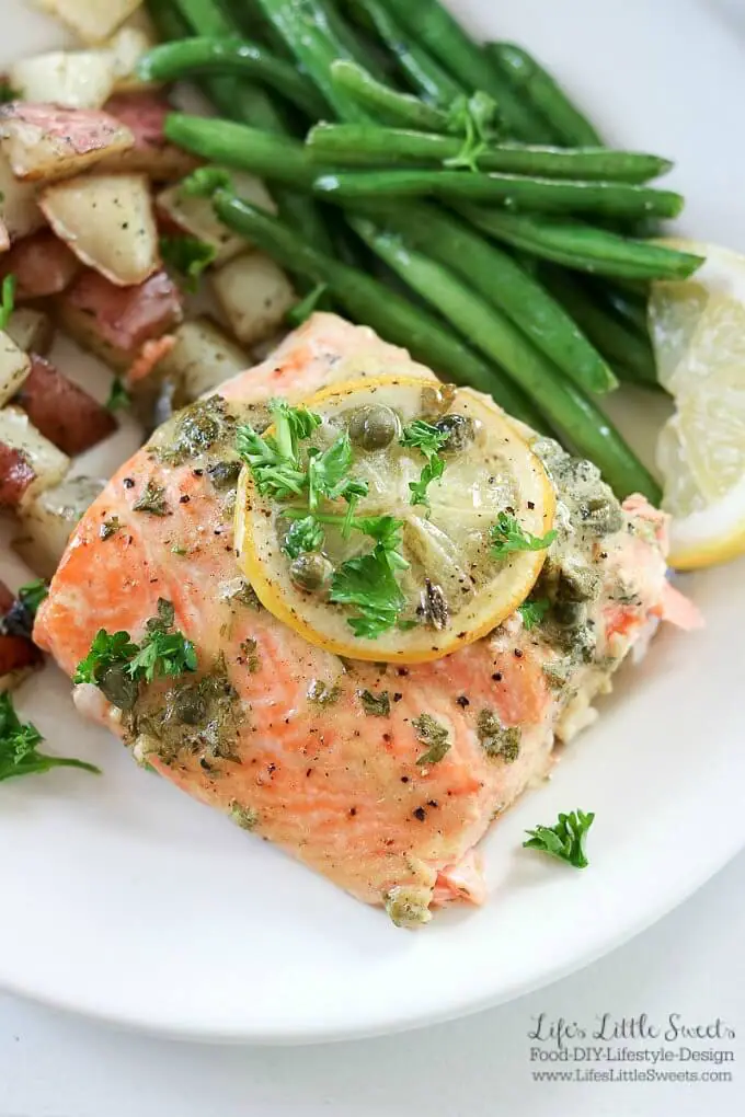 This Baked Dijon Lemon Caper Salmon Dinner is flavorful as it is delicious. Salmon lovers can rejoice with Dijon, lemon and caper flavor infused into melt-in-your mouth fillets of salmon. Served with roasted dill red potatoes and green beans, this dinner is sure to be a new family favorite! #salmon #greenbeans #potatoes #lemon #capers #Dijon #dinner #meal