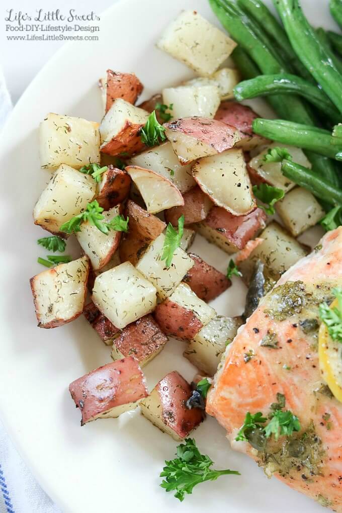 This Baked Dijon Lemon Caper Salmon Dinner is flavorful as it is delicious. Salmon lovers can rejoice with Dijon, lemon and caper flavor infused into melt-in-your mouth fillets of salmon. Served with roasted dill red potatoes and green beans, this dinner is sure to be a new family favorite! #salmon #greenbeans #potatoes #lemon #capers #Dijon #dinner #meal