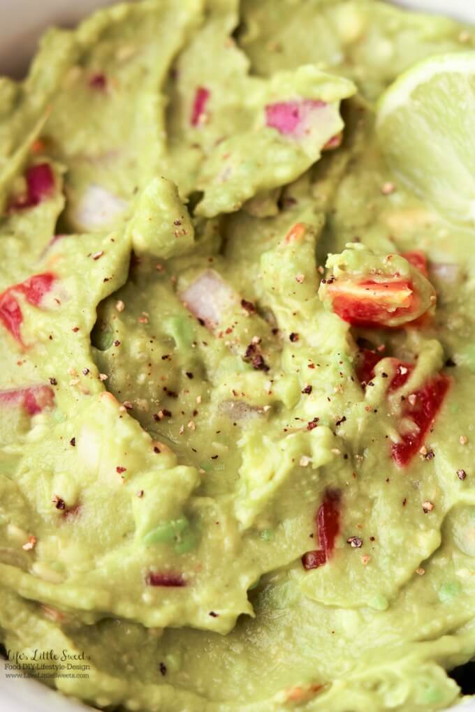 Close up | This Easy Guacamole is fresh and a perfect recipe for Spring and Summer. A simple recipe with red onions, fresh chopped tomatoes and a spritz of lime, enjoy it for any gathering, game day or a quick snack for yourself!
