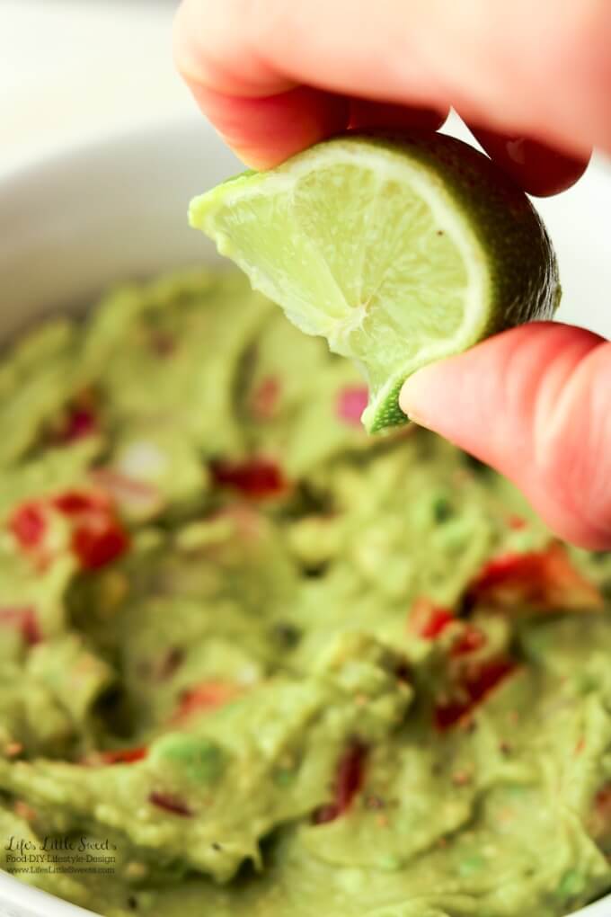 Spritz of lime | This Easy Guacamole is fresh and a perfect recipe for Spring and Summer. A simple recipe with red onions, fresh chopped tomatoes and a spritz of lime, enjoy it for any gathering, game day or a quick snack for yourself!
