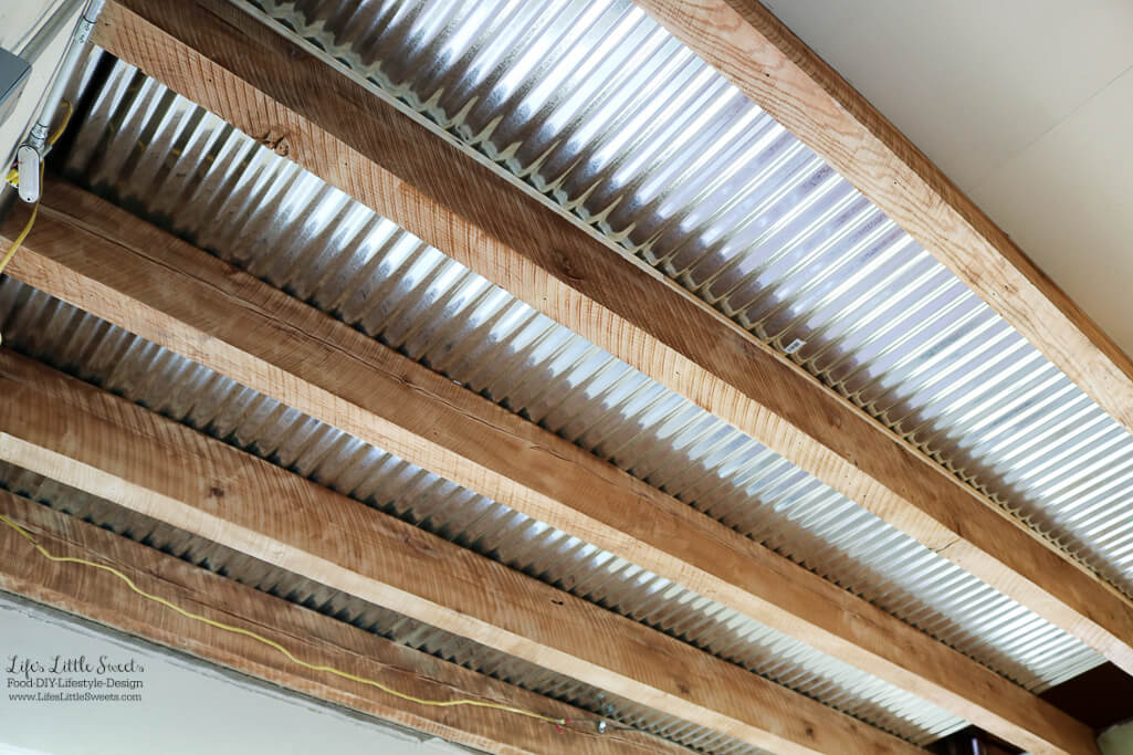 Metal ceiling with wood beams | Kitchen Renovation Ceiling Walls and Plumbing Update - Here's our latest update on the last 2 weeks for our modern, industrial Kitchen Renovation Project Series (45 photos!). www.LifesLittleSweets.com