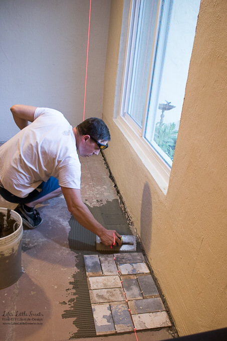 4. Eric just starting the corner of the room, close to the living room | Kitchen Renovation New Tile Floor – Check out the latest from the Life’s Little Sweets home kitchen renovation being our tile floor odyssey this past week (and other updates with 45 photos!)