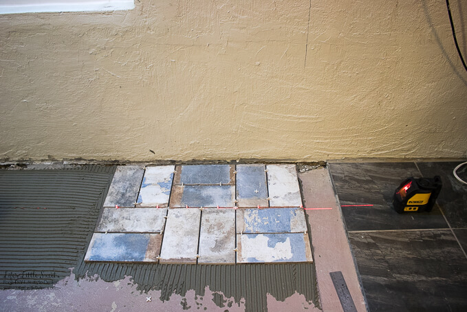 5. Using a laser level to keep those tile joints straight | Kitchen Renovation New Tile Floor – Check out the latest from the Life’s Little Sweets home kitchen renovation being our tile floor odyssey this past week (and other updates with 45 photos!)