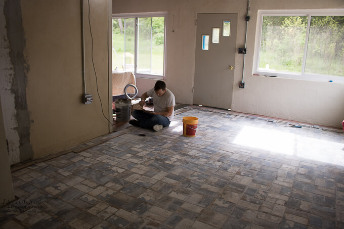 30. Eric installing the cut tile pieces and the threshold tiles after our family visit to the tile store. | Kitchen Renovation New Tile Floor – Check out the latest from the Life’s Little Sweets home kitchen renovation being our tile floor odyssey this past week (and other updates with 45 photos!)