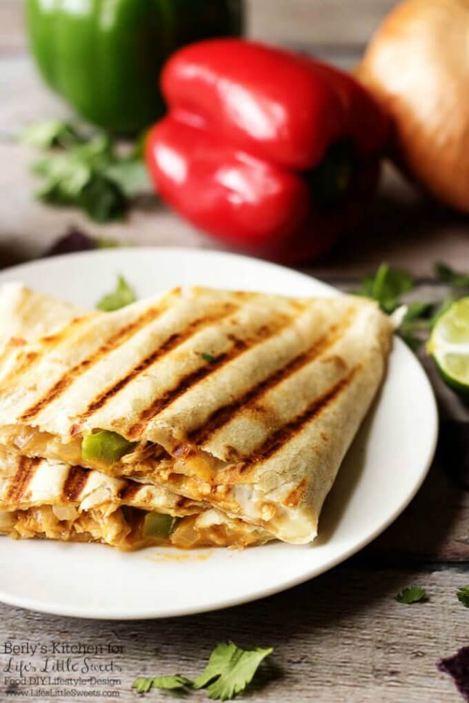 Who can resist a plate? | Celebrate Fiesta Friday with these delicious grilled cheesy chicken fajita quesadillas. They are cooked to perfection and loaded with chicken and pepper jack cheese! www.lifeslittlesweets.com