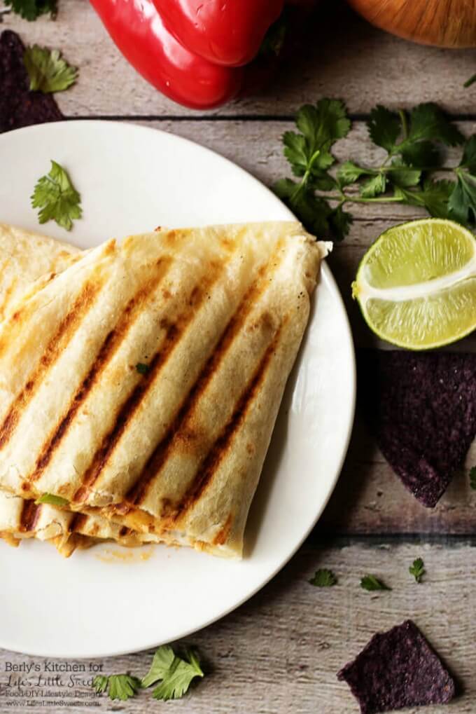 Great for entertaining! | Celebrate Fiesta Friday with these delicious grilled cheesy chicken fajita quesadillas. They are cooked to perfection and loaded with chicken and pepper jack cheese! www.lifeslittlesweets.com