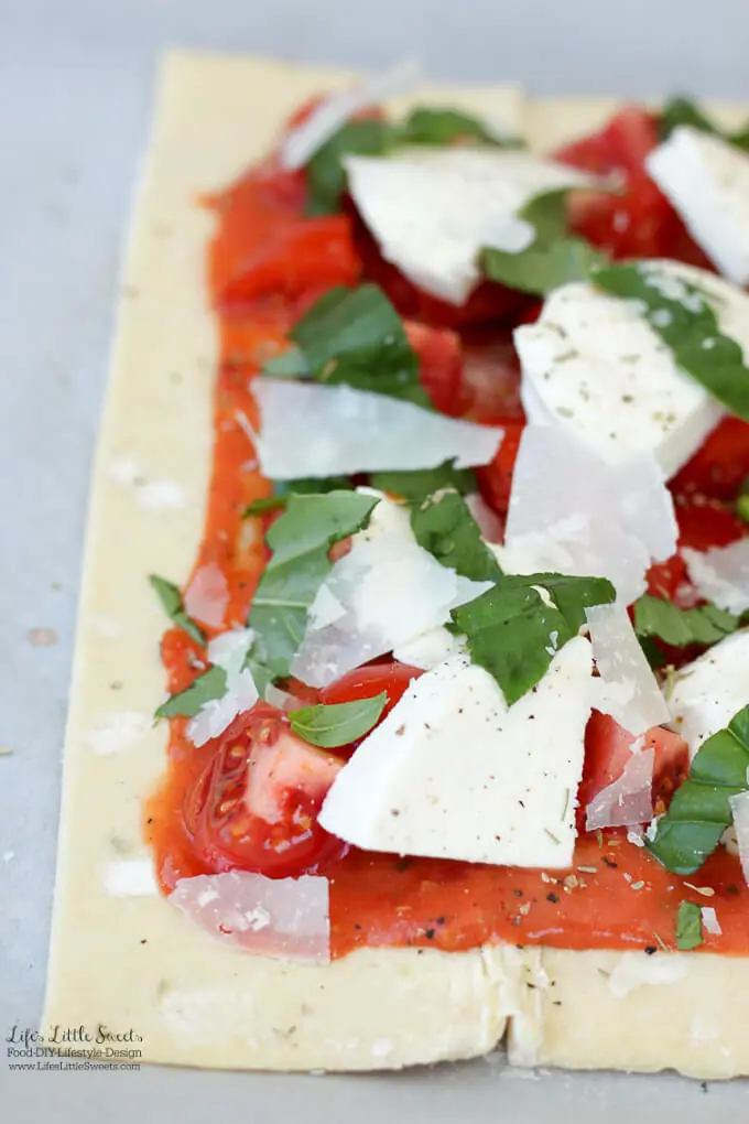 This Tomato Basil Mozzarella Puff Pastry Tart recipe is an easy, Summer-y and savory meal to make. No pizza dough making required! #pizza #tart #tomato #basil #puffpastry #recipe #Mozzarella #tomatosauce #caprese