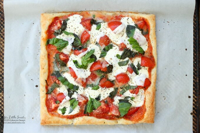 This Tomato Basil Mozzarella Puff Pastry Tart recipe is an easy, Summer-y and savory meal to make. No pizza dough making required! #pizza #tart #tomato #basil #puffpastry #recipe #Mozzarella #tomatosauce #caprese