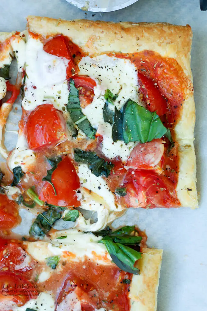 This Tomato Basil Mozzarella Puff Pastry Tart recipe is an easy, Summer-y and savory meal to make. No pizza dough making required! #pizza #tart #tomato #basil #puffpastry #recipe #Mozzarella #tomatosauce #caprese