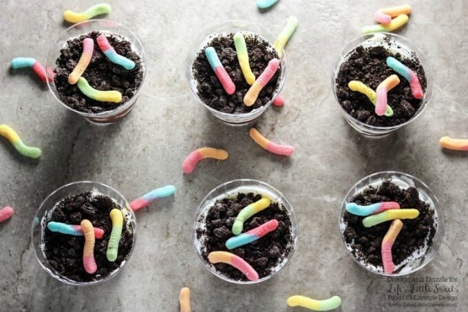 Overhead view of Dirt Cake Cups | Many of us have been told to not eat dirt. There are always exceptions and these Dirt Cake Cups are a fun way to break the rules. Perfect for a family-friendly get together or child's birthday party! www.lifeslittlesweets.com