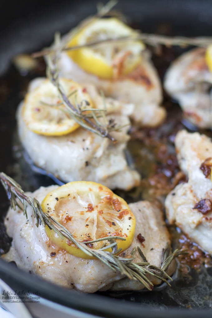 close up of lemon rosemary chicken thighs in a skillet