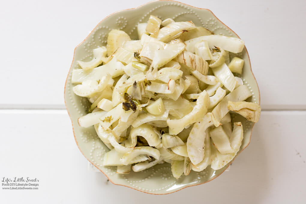 Roasted Fennel Recipe in a green bowl on a white wood board