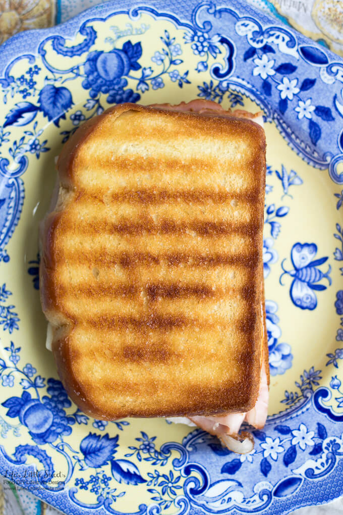 This Grilled Cheese Ham Sandwich has 2 kinds of cheese, Eckrich Virginia Brand Ham and sliced bread.