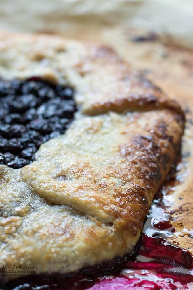 This Blueberry Galette recipe is a great dessert to showcase seasonal, fresh blueberries (you can use frozen out of season too!) encased in a homemade, flakey pie pastry dough. It goes perfectly with a large scoop of vanilla ice cream! #desserts #recipe #blueberries #sweet #fruit #berries #pie #galette #blueberrygalette