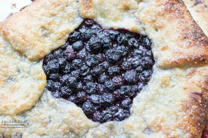 This Blueberry Galette recipe is a great dessert to showcase seasonal, fresh blueberries (you can use frozen out of season too!) encased in a homemade, flakey pie pastry dough. It goes perfectly with a large scoop of vanilla ice cream! #desserts #recipe #blueberries #sweet #fruit #berries #pie #galette #blueberrygalette
