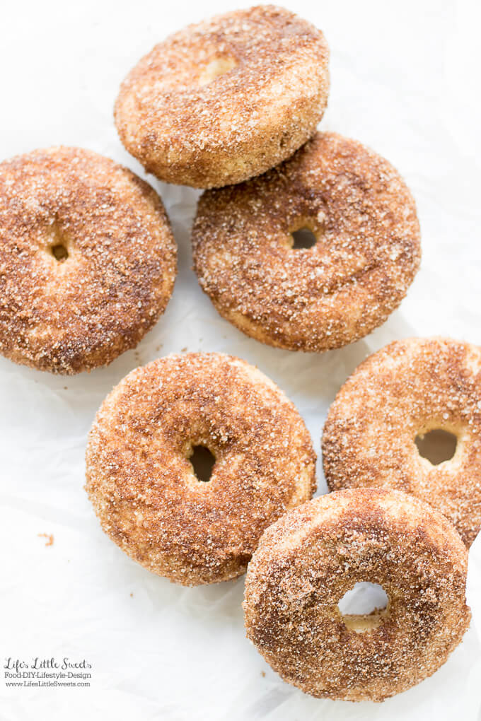 Baked Apple Cider Donuts are a delicious way to enjoy Fall. Infused with warm cinnamon and sweet apple cider, these classic donuts are also baked, not fried. #appleciderdonuts #nationaldonutday #donut #donuts #cinnamon #cinnamonsugar #applecider #doughnuts #baked #bakedappleciderdonuts