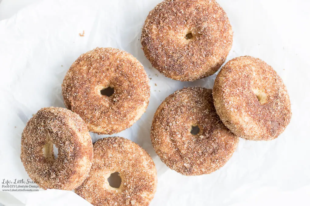 Baked Apple Cider Donuts are a delicious way to enjoy Fall. Infused with warm cinnamon and sweet apple cider, these classic donuts are also baked, not fried. #appleciderdonuts #nationaldonutday #donut #donuts #cinnamon #cinnamonsugar #applecider #doughnuts #baked #bakedappleciderdonuts