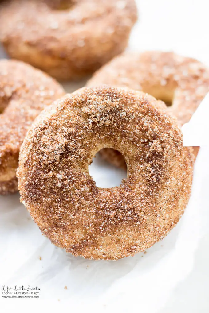 Baked Apple Cider Donuts are a delicious way to enjoy Fall. Infused with warm cinnamon and sweet apple cider, these classic donuts are also baked, not fried. #appleciderdonuts #nationaldonutday #donut #donuts #cinnamon #cinnamonsugar #applecider #doughnuts #baked #bakedappleciderdonuts