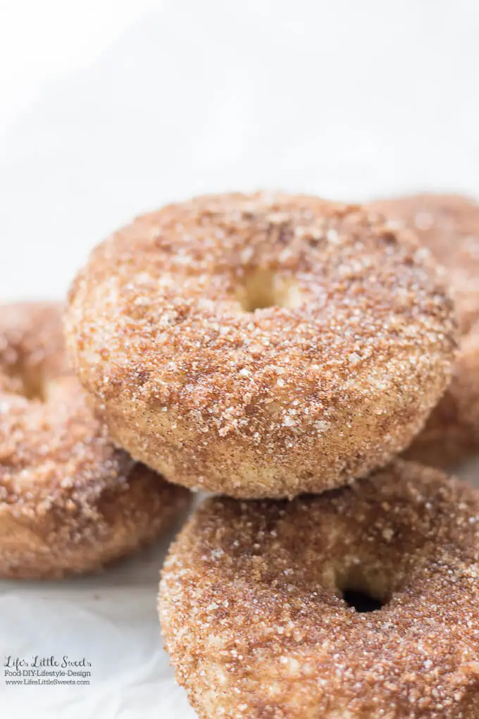 Baked Apple Cider Donuts are a delicious way to enjoy Fall. Infused with warm cinnamon and sweet apple cider, these classic donuts are also baked, not fried. #appleciderdonuts #nationaldonutday #donut #donuts #cinnamon #cinnamonsugar #applecider #doughnuts #baked #bakedappleciderdonuts