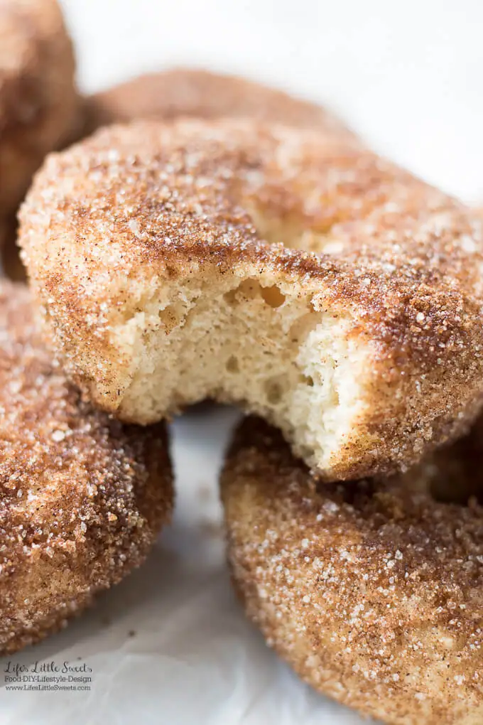 Baked Apple Cider Donuts are a delicious way to enjoy Fall. Infused with warm cinnamon and sweet apple cider, these classic donuts are also baked, not fried. #appleciderdonuts #nationaldonutday #donut #donuts #cinnamon #cinnamonsugar #applecider #doughnuts #baked #bakedappleciderdonuts