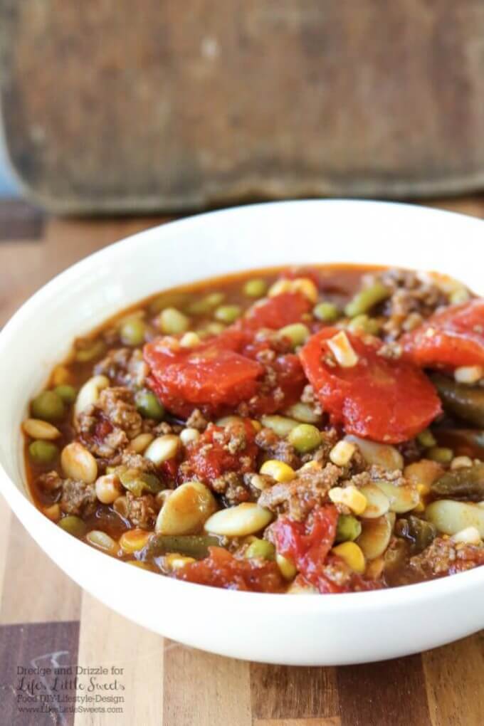 This Hamburger Vegetable Soup is hearty and flavorful and warms you from head to toe. And with so many veggie combinations available, it's totally customizeable to your tastes! #soup #hamburger #vegetable #hearty #beans #meat #stew