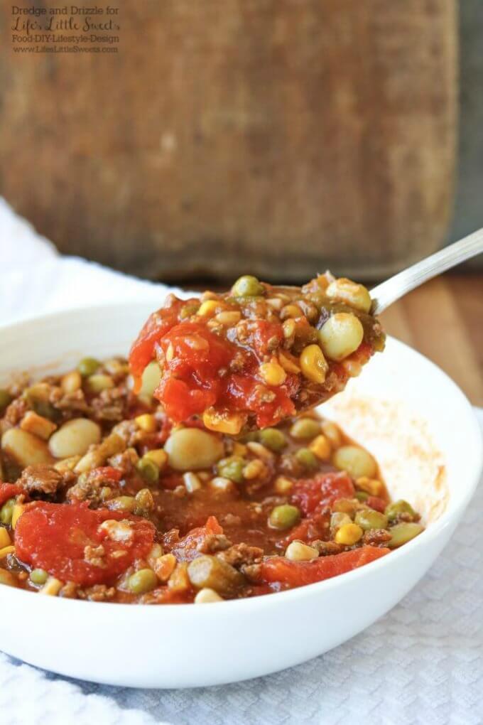 This Hamburger Vegetable Soup is hearty and flavorful and warms you from head to toe. And with so many veggie combinations available, it's totally customizeable to your tastes! #soup #hamburger #vegetable #hearty #beans #meat #stew
