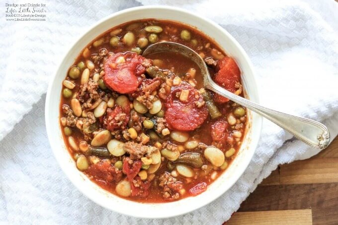 This Hamburger Vegetable Soup is hearty and flavorful and warms you from head to toe. And with so many veggie combinations available, it's totally customizeable to your tastes! #soup #hamburger #vegetable #hearty #beans #meat #stew