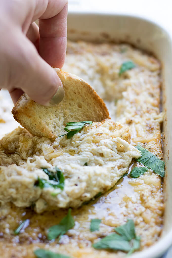 This Creamy Cheesy Crab Dip is a hot, savory appetizer that is a crowd-pleaser at any gathering. Easy to make with only 6 ingredients and bakes in 30 minutes! #ad #sofabfood #crabdip #cheese #crab #dip
