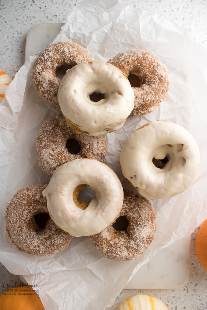 These Pumpkin Spice Baked Donuts are moist, baked, cake donuts and can be topped with a pumpkin spice - sugar mixture and/or a maple glaze. Enjoy them with coffee or tea on a Autumn day! (makes 12-13 donuts)