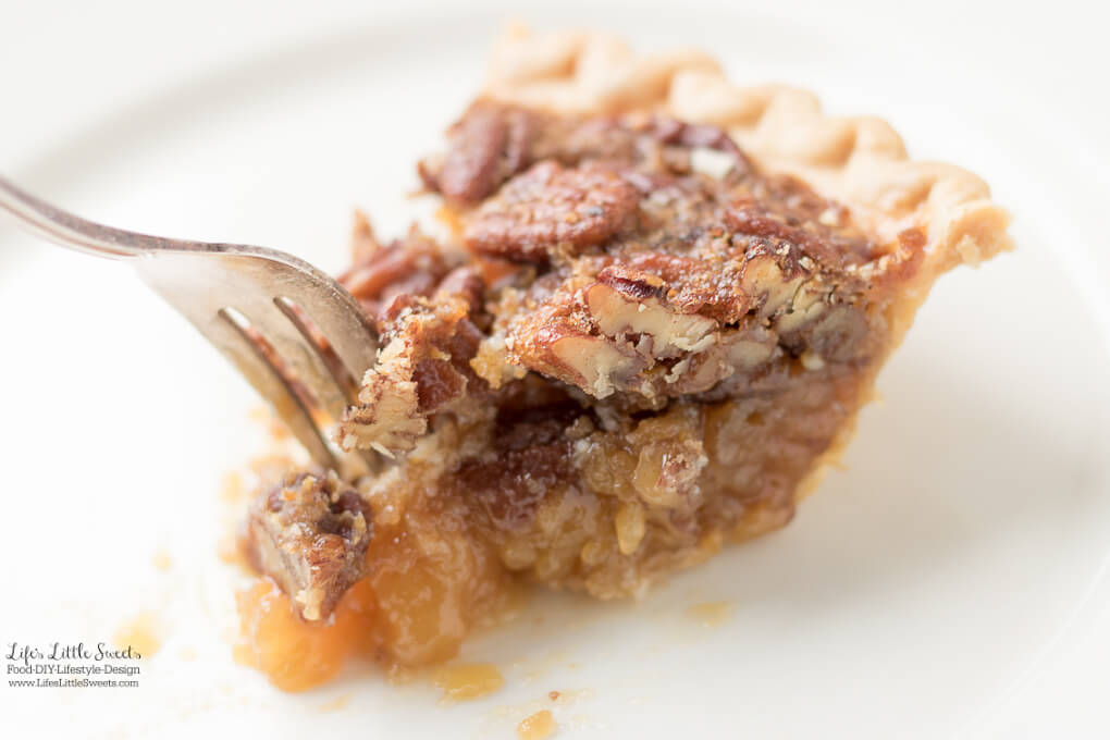 a slice of Easy Pecan Pie Recipe on a white plate with a fork